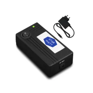 a black device with a white label and a green light